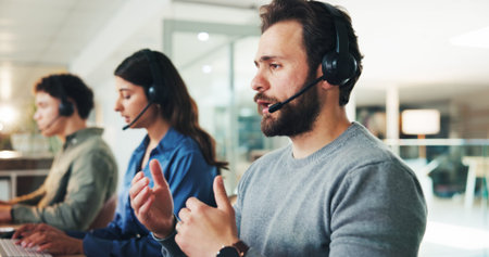 Man, call center and discussion with headset at office, contact us or explain for customer service...