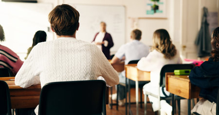 Teacher, education and students with woman in classroom for attention, learning and lecture....