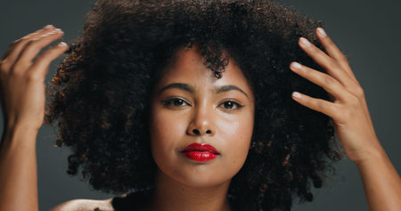 Hair, hands and portrait with woman in studio for beauty, growth or natural volume of afro....