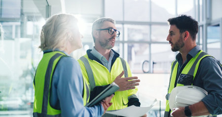 Teamwork, architect and people with blueprint in office, talk and planning for property development....