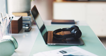 Online education, laptop or headset with school supplies, webinar or digital presentation for...