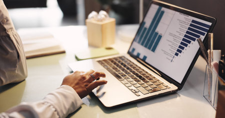 Hands, woman and laptop with graphs at house for accounting, analytics and finance balance. Person,...
