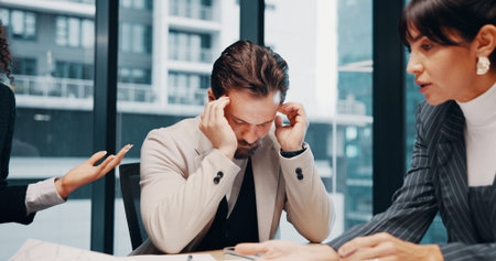 Business, meeting and people in office with headache, overwhelmed or burnout for project deadline....