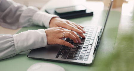Hands, typing and woman in office with laptop, administration and note taking for pr agency....