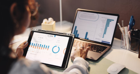 Hands, woman and tech with graphs at house for accounting, analytics and finance balance. Person,...