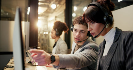 Computer, team and people in call centre with pointing, lens flare or assistance at night....