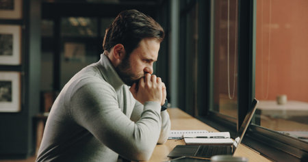 Thinking, office and business man on laptop for finance solution, investment decision and planning....