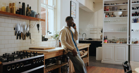 Talk, phone call and happy black man in kitchen for chat, gossip and communication with contact....