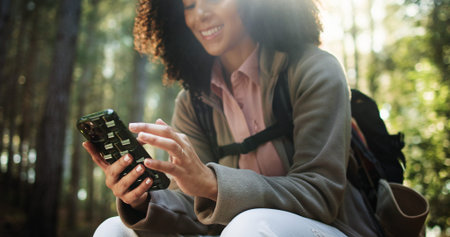Hiking, hands and woman with phone in forest for location search, check map and travel adventure....