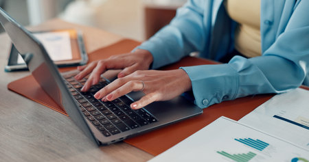 Hands, documents and businesswoman typing on laptop for finance report, data analysis or...