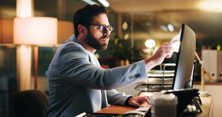 Computer, pointing and research with business man in office for trading analyst, planning and night....