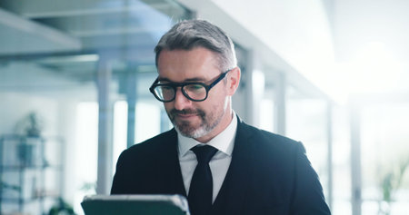 Office, employee and mature man with tablet, realtor and planning for listing on web or real estate....