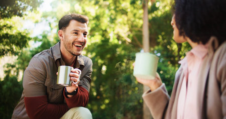 Couple, hiking and coffee break in forest with conversation, rest or laugh on travel adventure in...