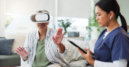 Healthcare, tablet or virtual reality with nurse and old woman in home for cognitive rehabilitation....