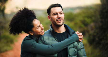 Couple, love and hug on hike, forest or bonding for adventure, think and happy in nature or fitness....