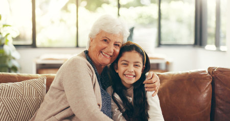 Portrait, home and grandmother with girl, hug and bonding together, smile, care and relax in lounge....