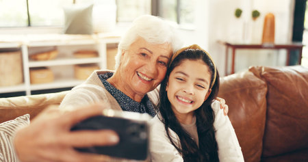 Relax, selfie and grandmother with child on sofa in family home for memory, bonding and profile...
