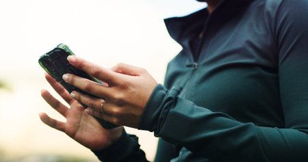 Fitness, app and phone with hands of woman in nature for running, tracker and social media. Summer,...