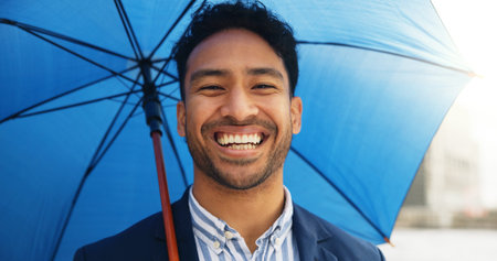 Happy, umbrella and portrait of businessman in city for travel, morning commute and trip to work....