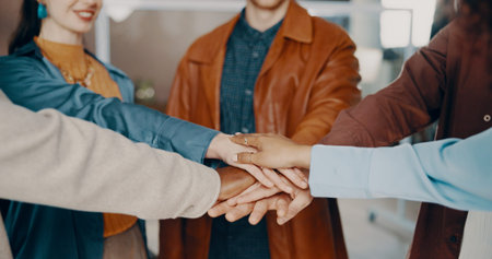 Hands, people and huddle in office for support, teamwork and collaboration or unity. Employees,...