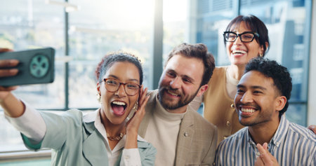 Selfie, happy and business people in office with smile for social media, teamwork and about us. Startup, creative agency and men with women with profile picture for company website, update and postの写真素材