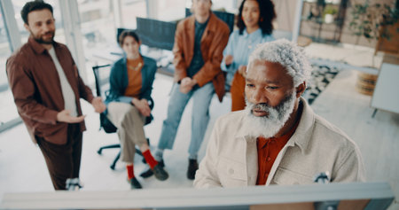 Man, presentation and board at startup in office meeting with team, planning or notes at media company. Mature person, above and checklist for project management, solution or group at creative agencyの写真素材