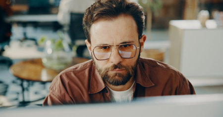 Digital marketing, man or reading on computer in office, review or improve idea for campaign...