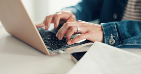 Typing, hands or man in office with laptop, research and content planning in creative agency....