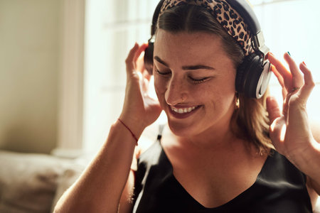 Relax, music and woman with headphones, smile and chilling with radio, streaming and comfortable....