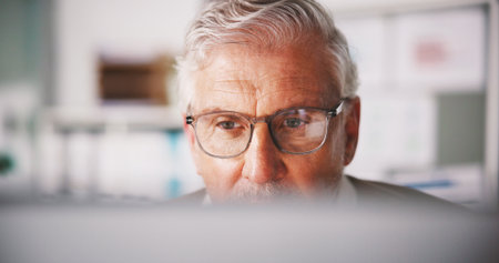 Mature, computer and glasses with business man in office for seo research, blog traffic and review. Search volume report, planning and engagement ranking with person in media agency for kpi insightの写真素材