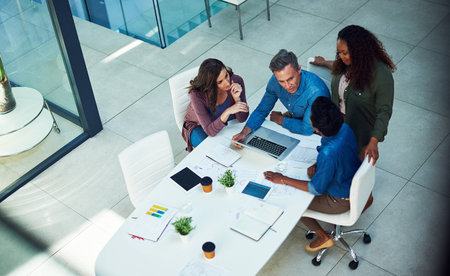 Team, discussion and people with laptop, boardroom or review ad campaign on web, browse and meeting....