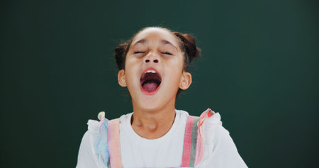 Sneeze, kid and girl in studio, sick and illness with flu symptoms on green background. Mockup...