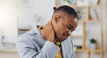 Neck pain, crisis and black man with anatomy injury, bad medical emergency or office strain problem. Burnout fatigue, muscle accident and tired person, business employee or agent with stress tensionの写真素材