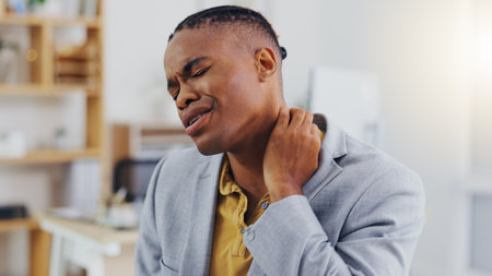 Neck pain, crisis and black man with anatomy injury, bad medical emergency or office strain problem. Burnout fatigue, muscle accident and tired person, business employee or agent with stress tensionの写真素材