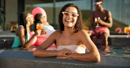 Happy, sunglasses and woman in pool at party at vacation house for break with friends. Smile, relax and female person swimming in water at luxury home on holiday at lodge, resort or hotel in summer.の写真素材