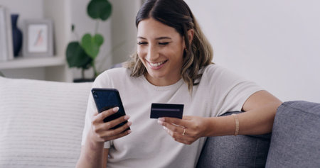 Credit card, phone and smile with woman on sofa for online shopping, banking app and password....