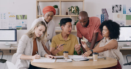 Editorial team, office meeting or paperwork in creative agency, article feedback or changes for feature. Magazine publication, people and review story draft for grammar, tips or ideas on sticky notesの写真素材