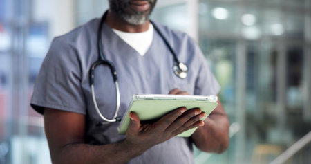 Surgeon, hands and tablet in hospital for healthcare report, research or insurance information. Technology, medical nurse and mature man with wellness email, telehealth app and patient recordsの写真素材