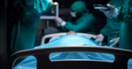 Medical, surgery and team with people in operating room for emergency, heart transplant procedure and support. Healthcare, accident and patient with doctors in hospital for cardiology treatmentの写真素材