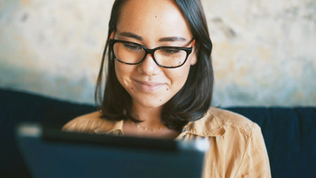 Happy, woman and creative with tablet, lounge and journalist with article on website and remote...