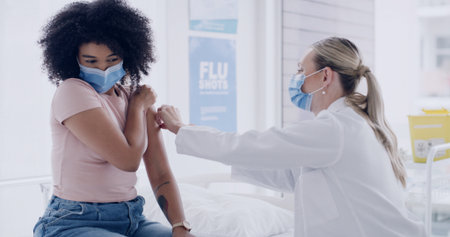 Injection, doctor or woman with flu vaccine in clinic for illness protection, immune booster or checkup. Healthcare mask, professional or patient on hospital bed for influenza shot, wellness and helpの写真素材