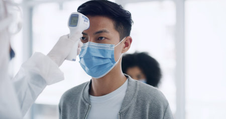 Thermometer, face mask and hands of nurse with man in hospital for fever at medical consultation....