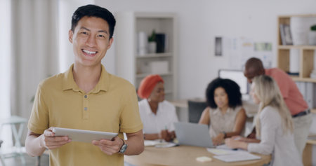 Portrait, leader and man with tablet, meeting and confident for ad campaign results on social media. Happy, marketing manager and people with tech for brand awareness, research and team in officeの写真素材