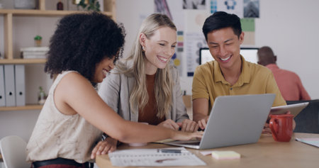 Media agency, laptop and people in office, smile and feedback for news report. Magazine editor, journalists or employees in meeting, teamwork or tech for email, online reading or proposal for articleの写真素材