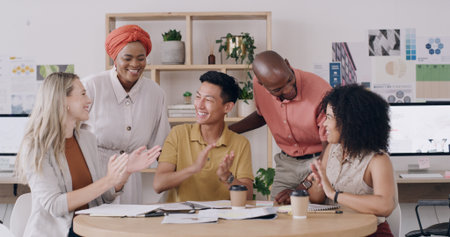 People, applause and excited with team, graphic design and support for achievement, goals or success. Group, men and women with celebration, motivation or smile for project funding at creative agencyの写真素材