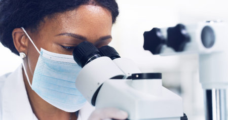 Microscope, research and face mask with black woman in lab for chemical study, medical and sample....