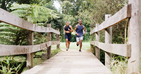 Athlete, couple and running on bridge for fitness, team exercise and cardio training. People, runner...