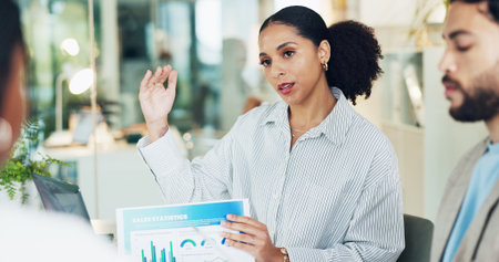 Documents, feedback and presentation with business woman in boardroom for sales statistics. Charts, graphs and paperwork with employee person in office for review of data or market informationの写真素材