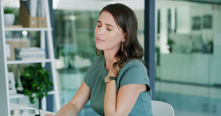 Business woman, neck pain and injury with stress in office for overworked strain or pressure. Frustrated, female person or employee with discomfort, muscle tension or fatigue for burnout in workplaceの写真素材