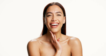 Laugh, beauty and portrait of woman in studio for skincare, wellness and natural glow on white background. Space, mockup and person with smile for health, shine and cosmetics for dermatology resultsの写真素材